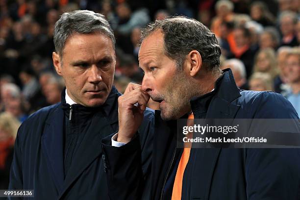 Netherlands coach Danny Blind and assistant Marco van Basten talk to each other ahead of the UEFA EURO 2016 Qualifying Group A match between the...