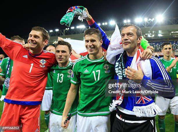 Northern Ireland goalkeeper Roy Carroll celebrates victory with teammates Patrick McNair , Corry Evans and goalkeeper Michael McGovern after the UEFA...