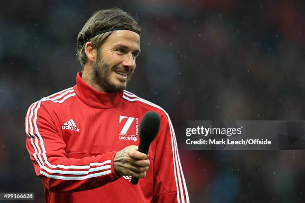 David Beckham holds a microphone as he addresses the crowd before his Match For Children, in aid of UNICEF, between a Great Britain XI and a Rest of...