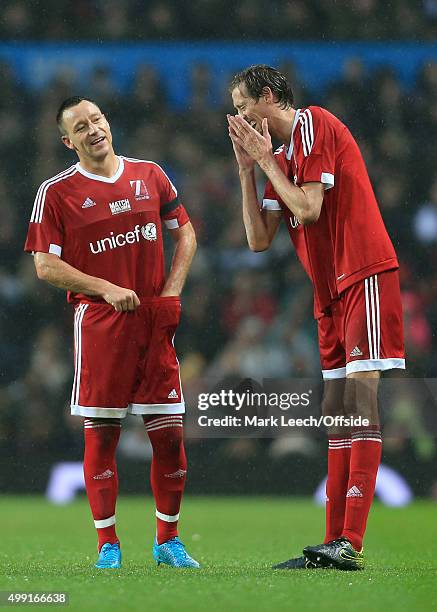 John Terry of GB jokes with Peter Crouch of GB during David Beckham's Match For Children, in aid of UNICEF, between a Great Britain XI and a Rest of...
