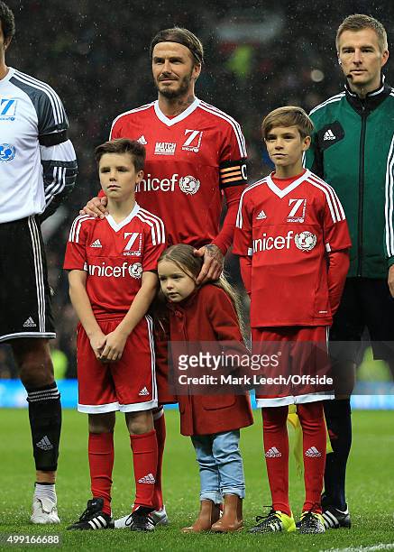 David Beckham of GB stands with his sons Cruz and Romeo and daughter Harper before David Beckham's Match For Children, in aid of UNICEF, between a...