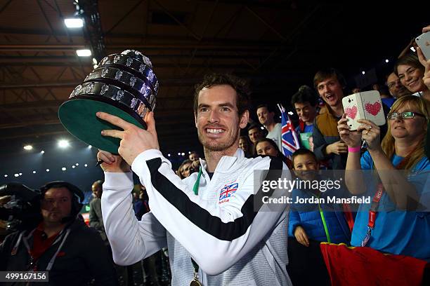 Andy Murray of Great Britain lifts the trophy following their victory during day three of the Davis Cup Final match between Belgium and Great Britain...