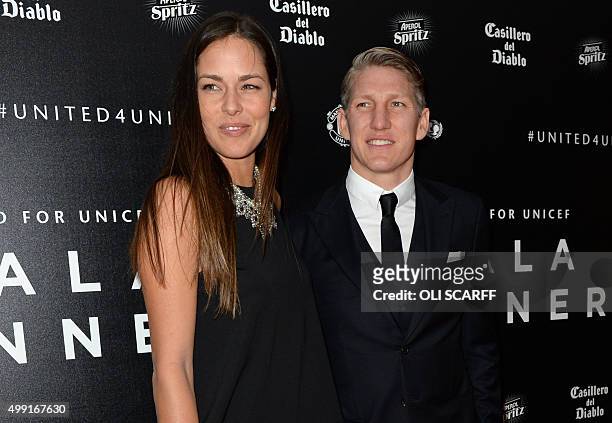 Manchester United's German midfielder Bastian Schweinsteiger and his girlfriend, tennis player Ana Ivanovic pose for pictures on the red carpet as...