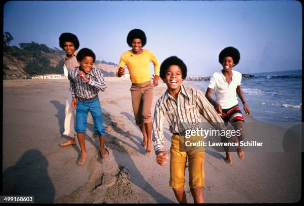 Sibling American pop music group the Jackson 5 dance on a beach around the time of 'Diana Ross Presents the Jackson 5,' their debut album, Los...