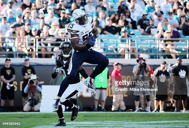 Antonio Gates of the San Diego Chargers scores a touchdown in the second quarter as Davon House of the Jacksonville Jaguars defends at EverBank Field...