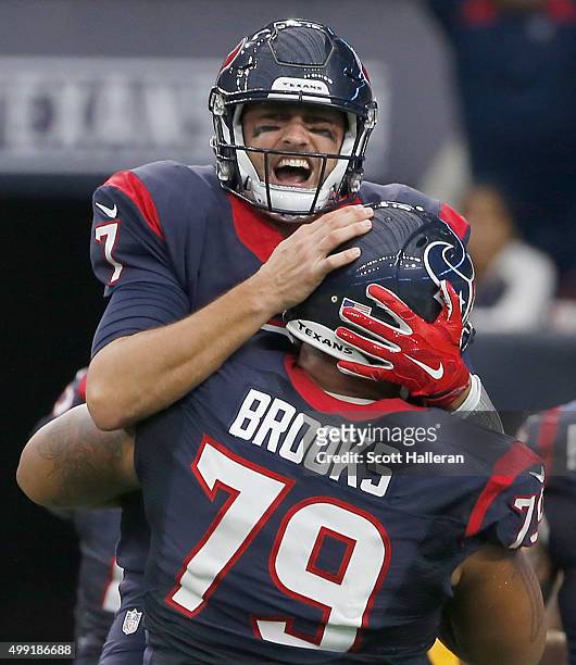 Brian Hoyer and Brandon Brooks of the Houston Texans celebrates a touchdown against the New Orleans Saints in the third quarter on November 29, 2015...