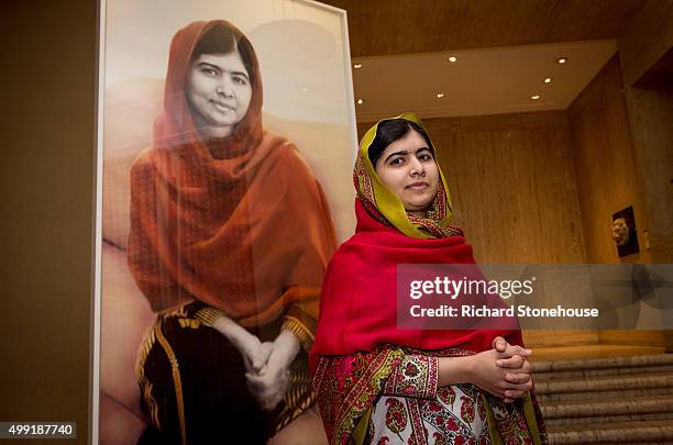 Malala Yousafzai unveils her official portrait by artist Nasser Azam at Barbar Institute Of Fine Art on November 29, 2015 in Birmingham, England.