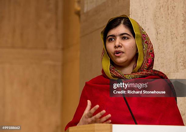 Malala Yousafzai gives a speech as she unveils her official portrait by artist Nasser Azam at Barbar Institute Of Fine Art on November 29, 2015 in...