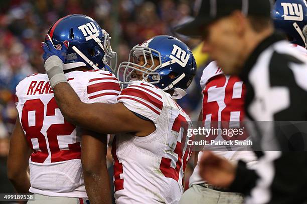 Wide receiver Rueben Randle of the New York Giants celebrates with running back Shane Vereen of the New York Giants after scoring a fourth quarter...