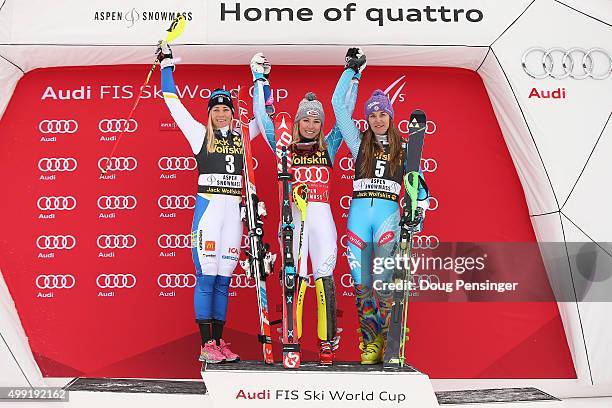 Mikaela Shiffrin of the United States celebrates her win on the podium along with Frida Hansdotter of Sweden in second place and Sarka Strachova of...