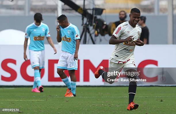 Andy Polo of Universitario celebrates after scoring the first goal of his team against Sporting Cristal during a match between Sporting Cristal and...
