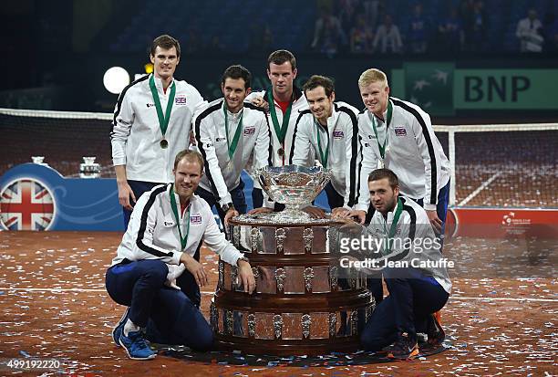 Andy Murray, Jamie Murray, Kyle Edmund, James Ward, Dan Evans, Dominic Inglot and Captain Leon Smith of Great Britain pose with Davis Cup following...