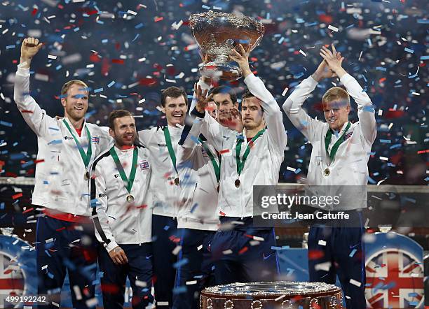 Andy Murray of Great Britain lifts the trophy following his team's victory on day three of the Davis Cup Final 2015 between Belgium and Great Britain...