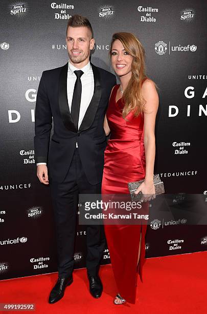 Morgan Schneiderlin and Camile Sold attend the United for UNICEF Gala Dinner at Old Trafford on November 29, 2015 in Manchester, England.
