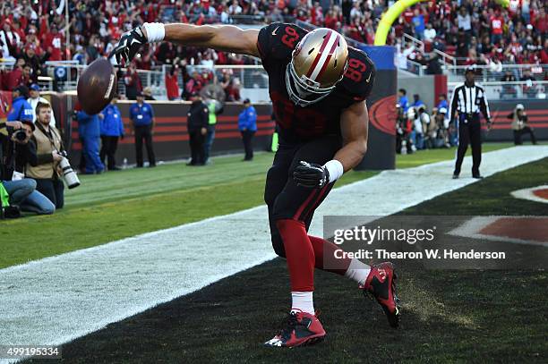 Vance McDonald of the San Francisco 49ers celebrates after scoring a touchdown on an eight-yard pass against the Arizona Cardinals during their NFL...