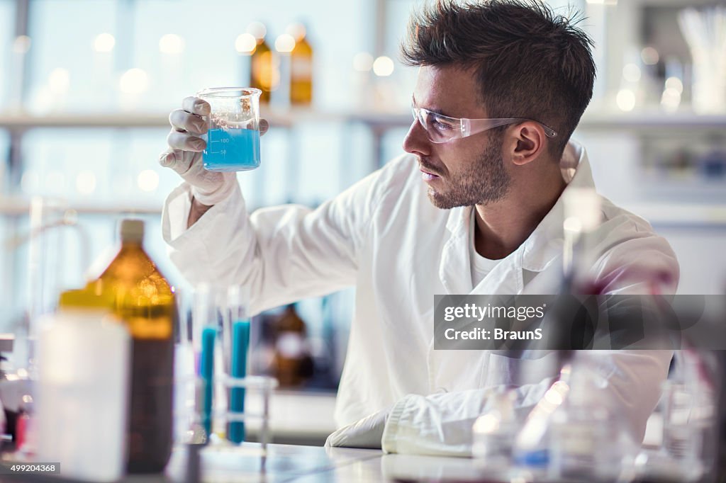 Male chemist working on chemical substances in a laboratory.