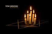 Yom Hashoah, candles and the star of David on black