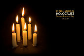 Holocaust Remembrance Day, January 27, candles against black