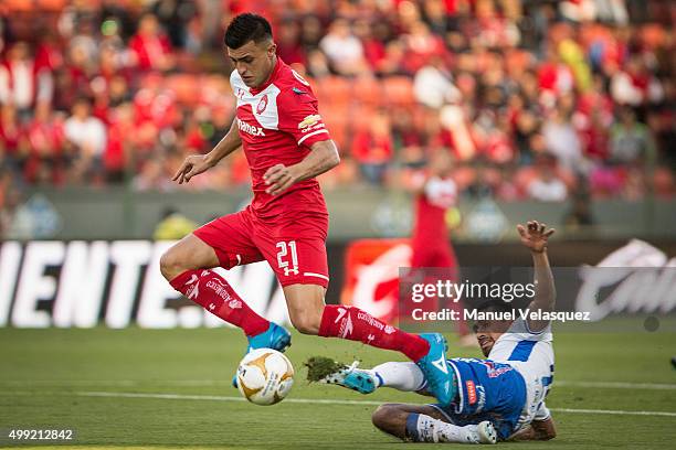 Enrique Triverio of Toluca struggles for the ball with Patricio Araujo of Puebla during the quarterfinals second leg match between Toluca and Puebla...