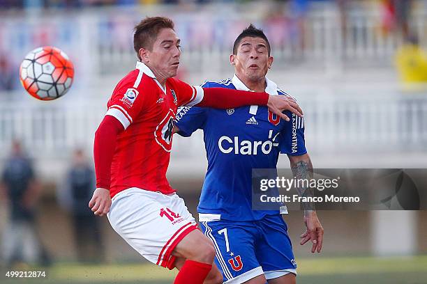 Francisco Castro of U de Chile fights for the ball with Yonathan Suazo of Union La Calera during a match between Union La Calera and U de Chile as...