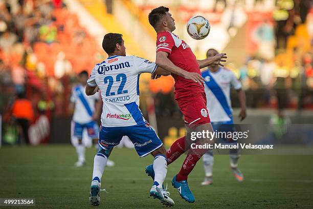 Patricio Araujo of Puebla struggles for the ball with Enrique Trevino of Toluca during the quarterfinals second leg match between Toluca and Puebla...