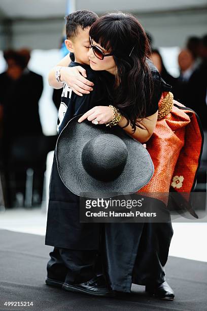 Widow of Jonah Lomu, Nadene Lomu hugs her son Dhyreille Lomu at the Public Memorial for Jonah Lomu at Eden Park on November 30, 2015 in Auckland, New...