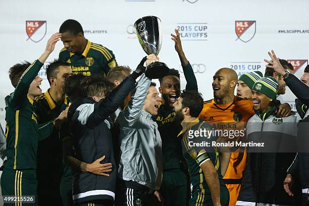 The Portland Timbers celebrate with the MLS Western Conference trophy after defeating FC Dallas in the Western Conference Finals-Leg 2 of the MLS...