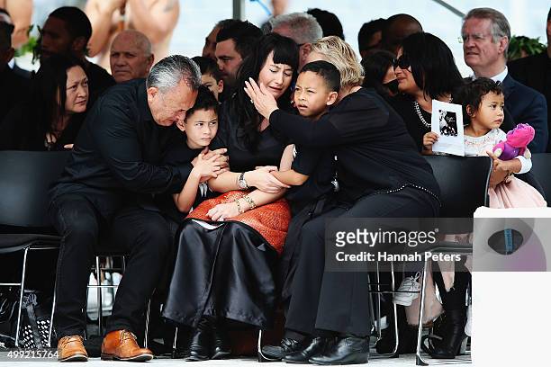 Widow of Jonah Lomu, Nadene Lomu is comforted by her two sons Brayley Lomu and Dhyreille Lomu, her mother Lois Kuiek and father Mervyn Kuiek during...