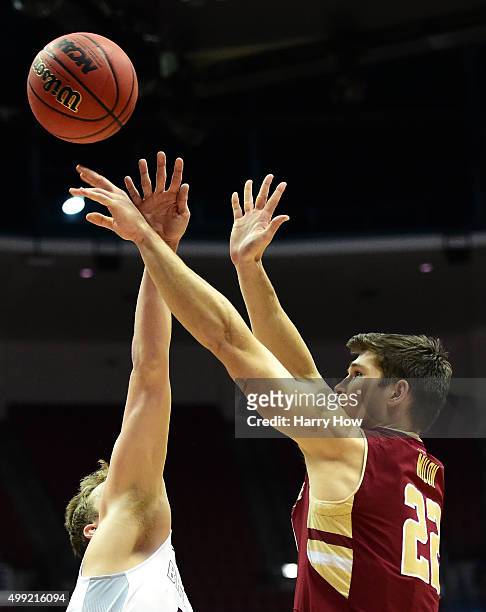 Matt Milon of the Boston College Eagles shoots a jumper over Kai Healy of the Santa Clara Broncos during the DirecTV Wooden Legacy at Honda Center on...