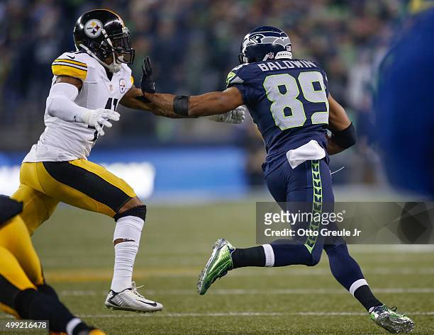 Wide receiver Doug Baldwin of the Seattle Seahawks rushes for a touchdown against defensive back Antwon Blake of the Pittsburgh Steelers in the...