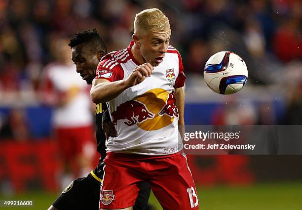 Mike Grella of New York Red Bulls controls the all in front of Harrison Afful of Columbus Crew during their match at Red Bull Arena on November 29,...