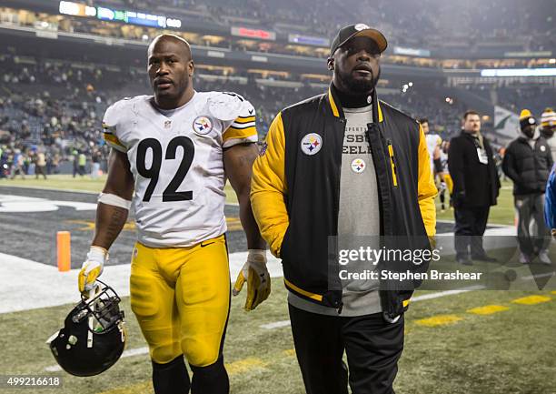 Linebacker James Harrison of the Pittsburgh Steelers and head coach Mike Tomlin walk off the field after a football game against the Seattle Seahawks...