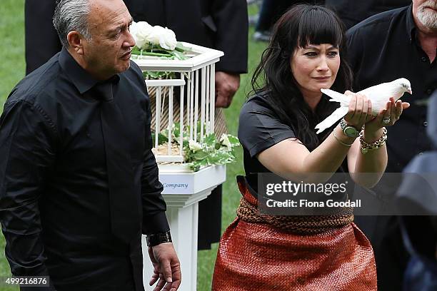 Nadene Lomu releases a dove as Jonah's casket leaves the field at the Public Memorial for Jonah Lomu at Eden Park on November 30, 2015 in Auckland,...