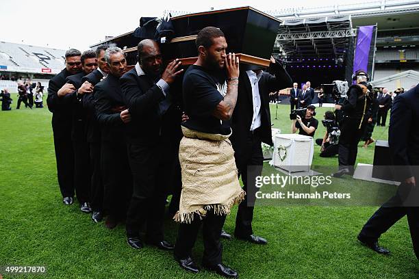 Former rugby players Dylan Mika, Michael Jones, Frank Bunce, Joeli Vidiri and rugby League player Manu Vatuvei carry the casket carrying Jonah Lomu...