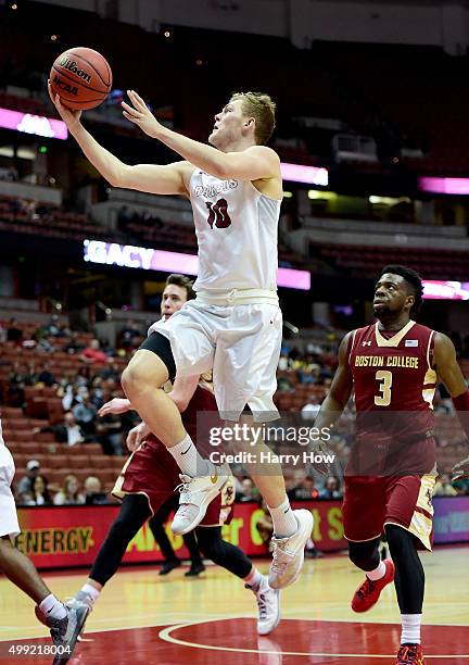 Ervins Meznieks of the Boston College Eagles scores on a layup in front of Eli Carter of the Boston College Eagles during the DirecTV Wooden Legacy...