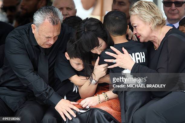 Widow of late New Zealand All Blacks rugby legend Jonah Lomu, Nadene Lomu is comforted by her two sons, Brayley and Dhyreille , and her mother Lois...