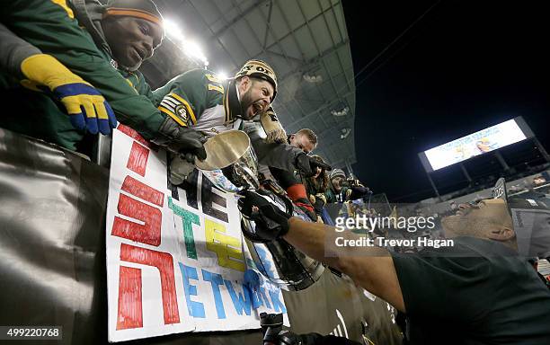 Eddie Steele of the Edmonton Eskimos holds the Grey Cup after the team defeated the Ottawa Redblacks at Investors Group Field during Grey Cup 103 on...