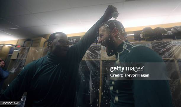 Odell Willis and Mike Reilly of the Edmonton Eskimos celebrating in the locker room after winning Grey Cup 103 against the Ottawa Redblacks at...