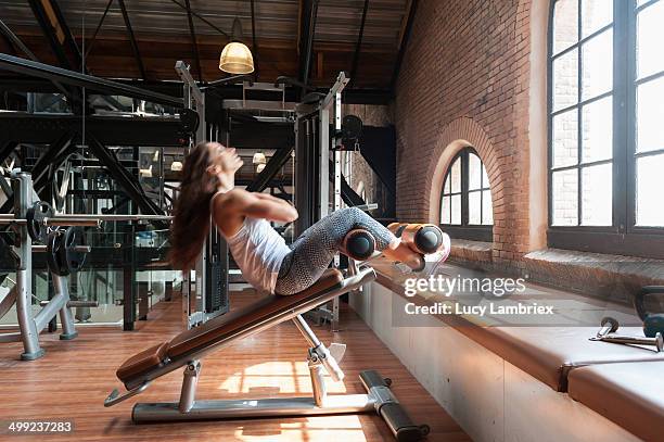 young woman at gym working her abs - blurred motion bildbanksfoton och bilder