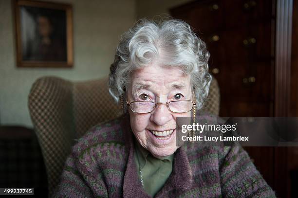 portrait of a happy 97-year-old lady looking up - alleen seniore vrouwen stockfoto's en -beelden