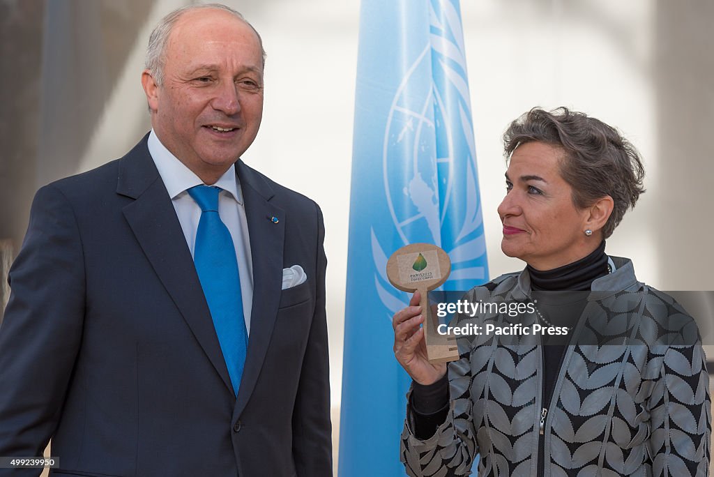 France Minister of Foreign Affairs Laurent Fabius (L) hands...