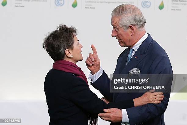 United Nations climate chief Christiana Figueres greets Britain's Prince Charles as he arrives for the COP21 United Nations Climate Change Conference...