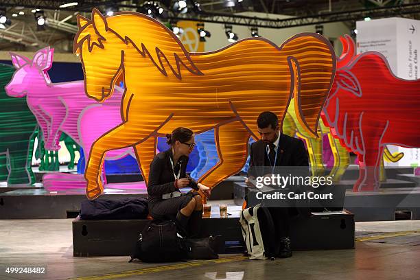 Attendees work next to animal sculptures at the United Nations Climate Summit on November 30, 2015 in Paris, France. Political leaders from 147...
