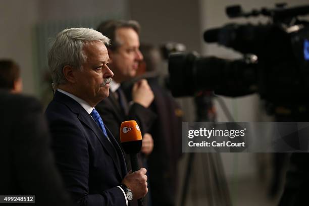 Broadcast journalist talks to camera as he works at the United Nations Climate Summit on November 30, 2015 in Paris, France. Political leaders from...