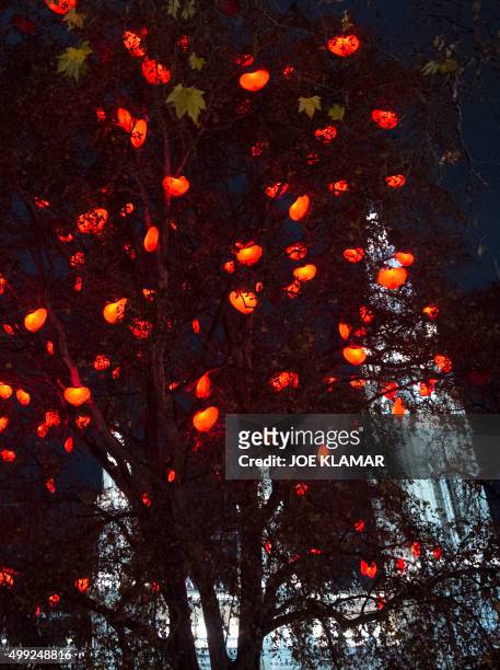 Hearts are fixed at the Christmas market in front of Vienna's City Hall on November 26, 2015 after Vienna officially lit up the city for the upcoming...