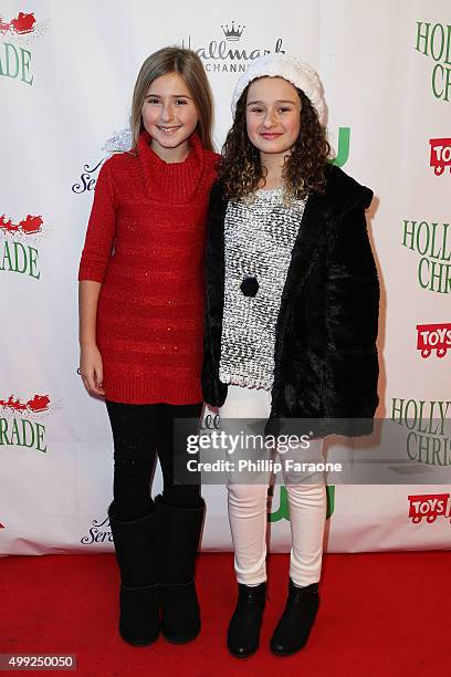 Hadley Belle Miller and Rebecca Bloom attend the 84th Annual Hollywood Christmas Parade on November 29, 2015 in Hollywood, California.