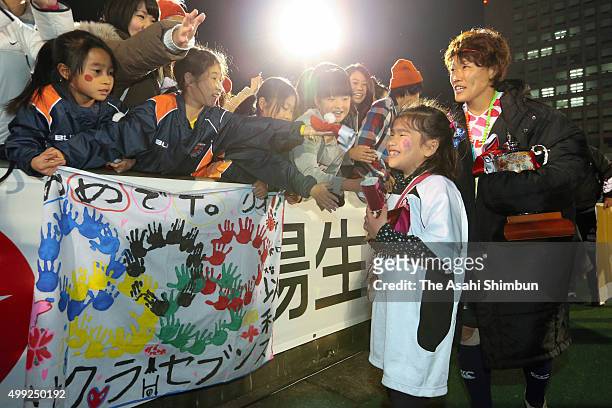 Yuka Kanematsu of Japan celebrates with her daughter Asuka after winning the World Sevens Asia Olympic Qualification match between Japan and...