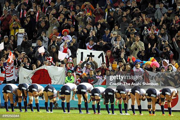 Japan Women's Sevens memberrs bow to applaud the supporters after winning the World Sevens Asia Olympic Qualification match between Japan and...