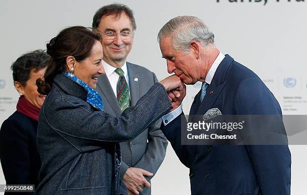 Segolene Royal, French Minister of Ecology, Sustainable Development and Energy welcomes Prince Charles, Prince of Wales as he arrives for the COP21...