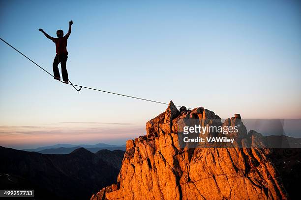 energy - tightrope walking stock-fotos und bilder